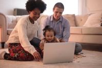 Banners and Alerts and Photo of Family Sitting on Floor While Using Laptop Free Stock Photo