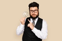 Bearded businessman holding a light bulb for innov 2021 10 05 16 46 03 utc
