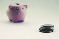 Coins and a Piggy Bank Free Stock Photo