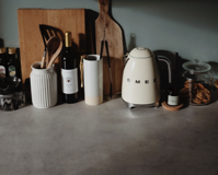 Countertop with utensil and cabinets in cozy kitchen Free Stock Photo