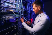 Focused data center employee checking cabling infr 2021 10 20 21 27 49 utc