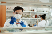 Man Doing A Sample Test In The Laboratory Free Stock Photo
