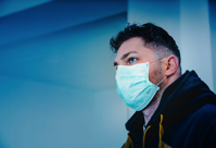 Man in Black and Yellow Jacket With White Face Mask Free Stock Photo