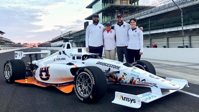Autonomous Tiger Racing team members (from left to right) Brendan Schretter, Elizabeth Keefer, Will Bryan and Stephanie Meyer pose with their autonomous vehicle at the Indianapolis Motor Speedway. The team will compete in the first-ever Indy Autonomous Challenge on Oct. 23, 2021.