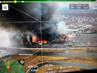 This 2022 aerial image provided by Ukrainian security forces, taken by a drone and shown on a screen, shows a blown-up building near the outskirts of Kyiv, Ukraine. The exact date and time of the image are unknown. In better times, Ukrainian drone enthusiasts flew their gadgets into the sky to photograph weddings, fertilize soybean fields or race other drones for fun. Now some are risking their lives by forming a volunteer drone force to help their country repel the Russian invasion. (Ukrainian Security Forces via AP)