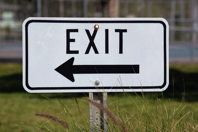 exit sign with an arrow pointing left