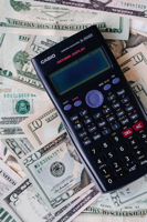 Investment - Calculator sitting on US Dollars