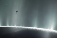 An illustration of Cassini diving through plumes erupting off Europa's surface.
NASA/JPL-CALTECH