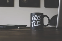 hustle on a coffee mug