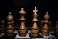 Wooden Chess Pieces on a Chess Board Free Stock Photo